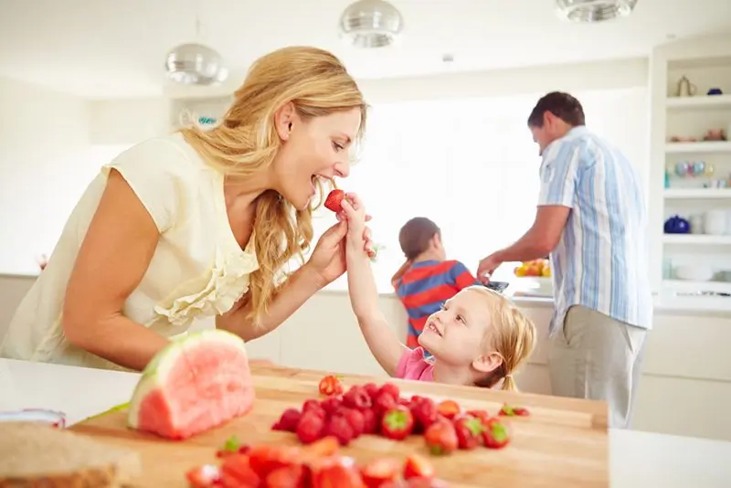 family in kitchen eating 