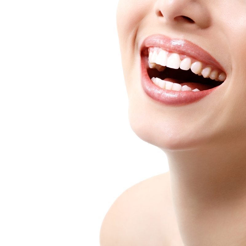 Dental crowns and veneers can be used to create a white, straight-toothed smile.